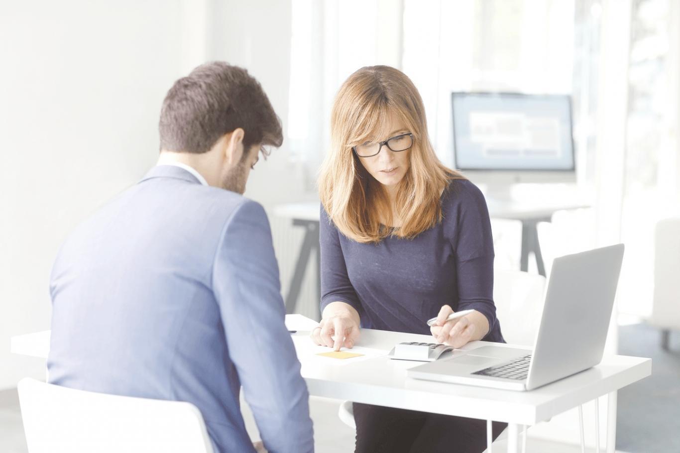 Budget planning tools and financial worksheets laid out on a desk